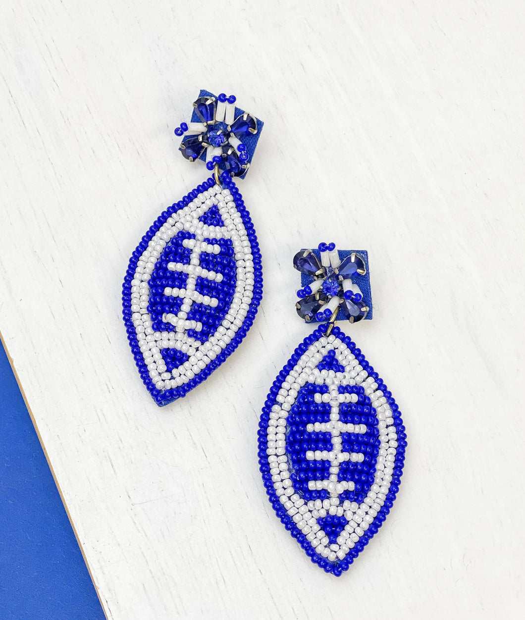 Blue football bead earrings